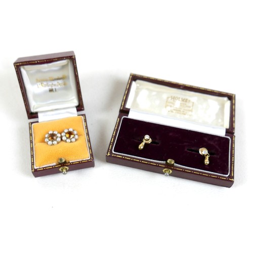 100 - A pair of diamond and gold earrings, each set with single diamond solitaire of approximately 0.1ct a... 