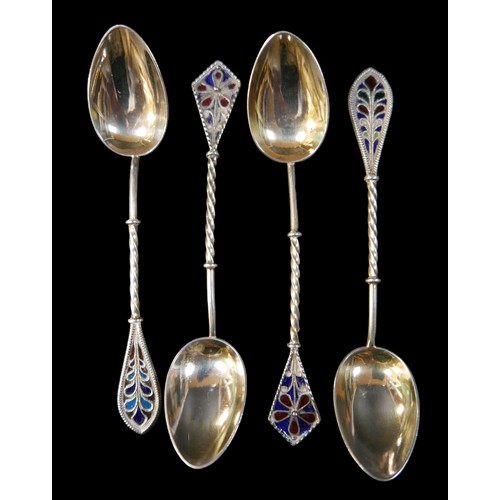 26 - Eleven items of silver, comprising four plique a jour spoons, a page mark, two rattles, a pot , lett... 