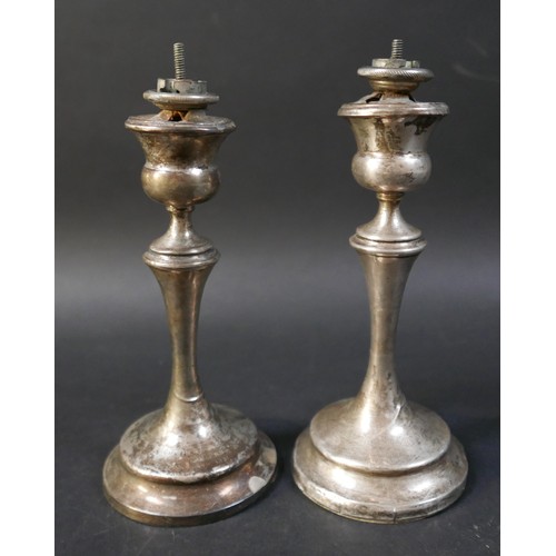 11 - A pair of silver candlesticks, engraved 'From The Officers 20th Lancers March 28th 1931', with weigh... 