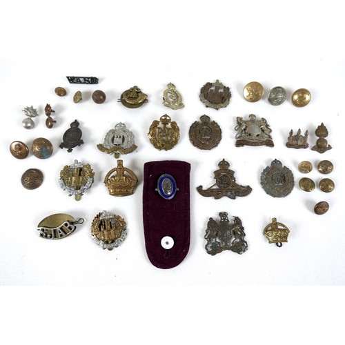 318 - A collection of thirty five military badges and buttons, together with a nurses lapel badge. (36)