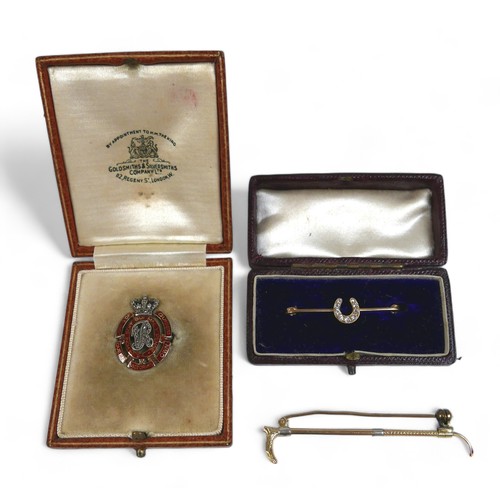 124 - Three gold brooches, comprising a platinum 15ct yellow gold riding crop, 6cm long, a diamond horsesh... 