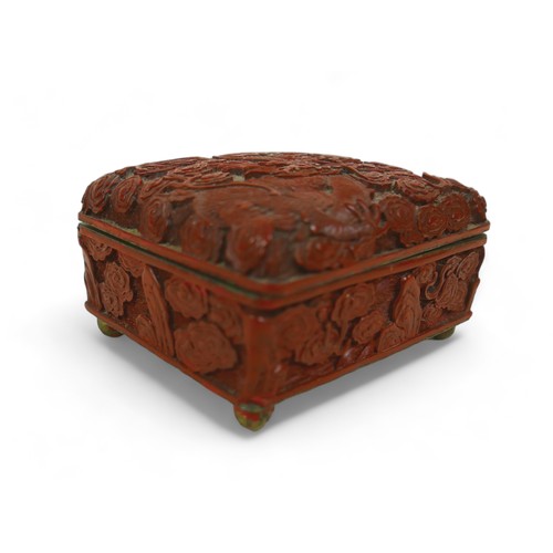 173 - An early 20th century Chinese Cinnabar lacquer jewellery box, of rectangular form with domed hinged ... 