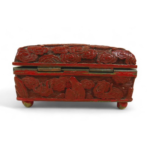 173 - An early 20th century Chinese Cinnabar lacquer jewellery box, of rectangular form with domed hinged ... 