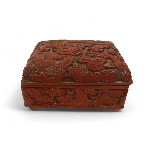 173 - An early 20th century Chinese Cinnabar lacquer jewellery box, of rectangular form with domed hinged ... 