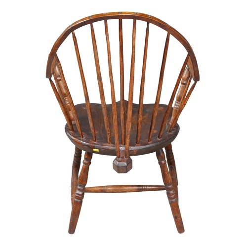 534 - A 19th century sack-back Windsor armchair, pine seat, H stretcher, 57 by 54 by 92cm high.