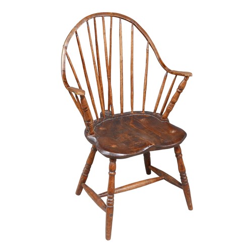 534 - A 19th century sack-back Windsor armchair, pine seat, H stretcher, 57 by 54 by 92cm high.