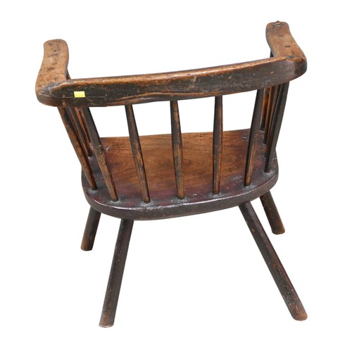 522 - A low 18th century oak rustic stick back armchair, plain legs, 55 by 40 by 61cm high.