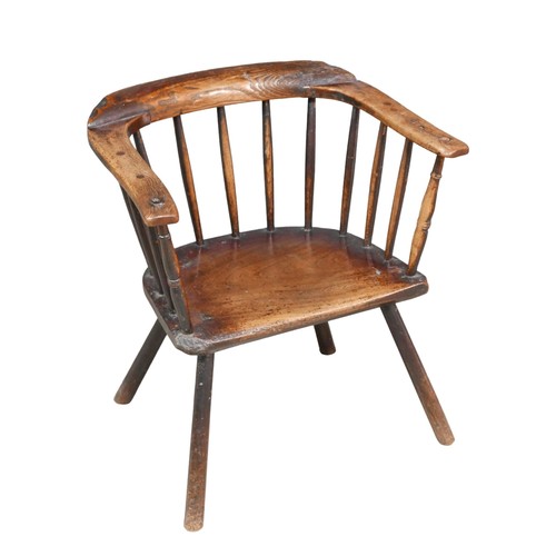 522 - A low 18th century oak rustic stick back armchair, plain legs, 55 by 40 by 61cm high.