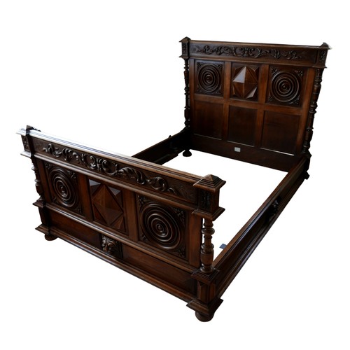 526 - A late 19th century oak bed frame, with carved panel decoration, 212 by 60 by 135cm high.