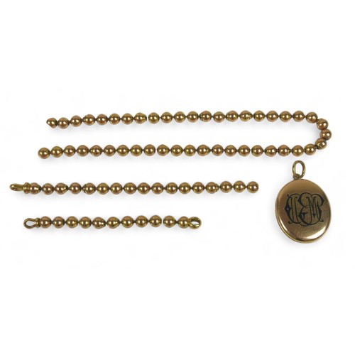 143 - A yellow gold globe link necklace (broken) with a gilt metal locket, chain tests to 18ct on the clas... 