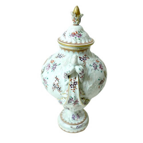 218 - A 19th century Porcelain de Paris twin handle lidded vase, decorated with floral sprays and white tu... 