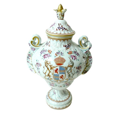 218 - A 19th century Porcelain de Paris twin handle lidded vase, decorated with floral sprays and white tu... 