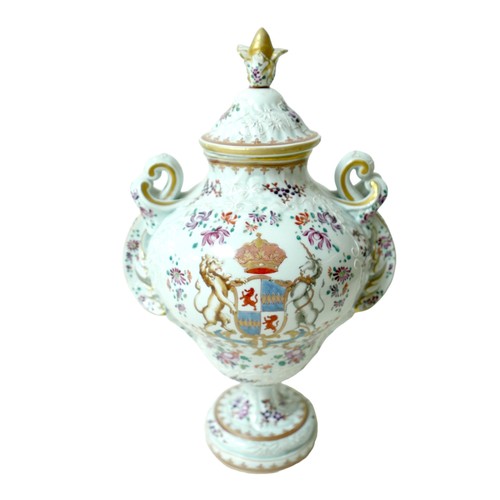 218 - A 19th century Porcelain de Paris twin handle lidded vase, decorated with floral sprays and white tu... 