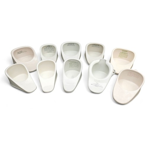 198 - A group of ten antique ceramic bedpans, of slipper form, including a side handled 'Ideal' pan, 40cm ... 