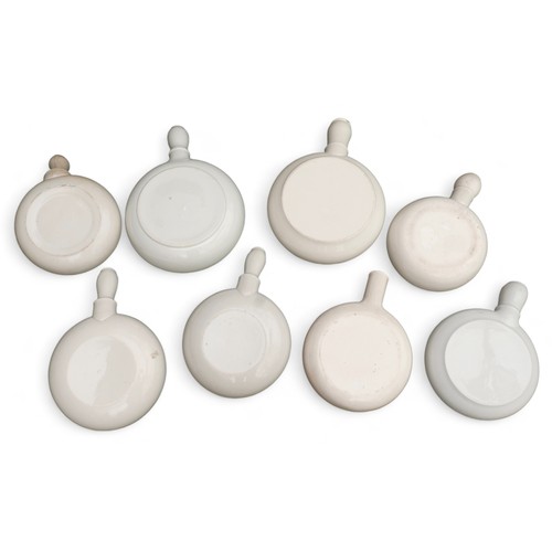 201 - A group of eight antique ceramic bedpans, of Round form, six small and two large, largest 46.5cm lon... 