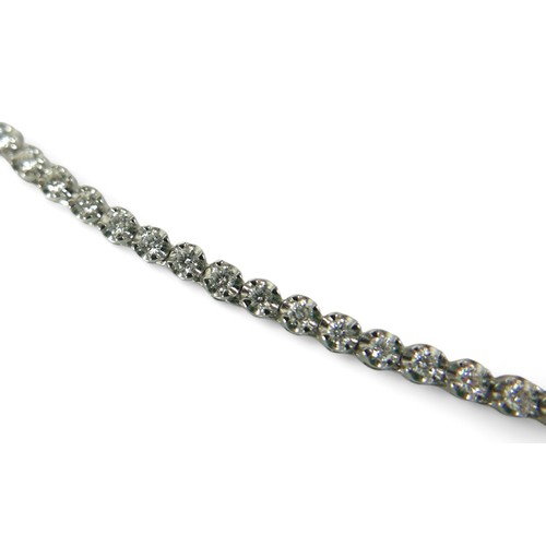 152 - A diamond and 18ct white gold graduated riviere necklace, by Heidi Kjeldsen, comprising 140 diamonds... 