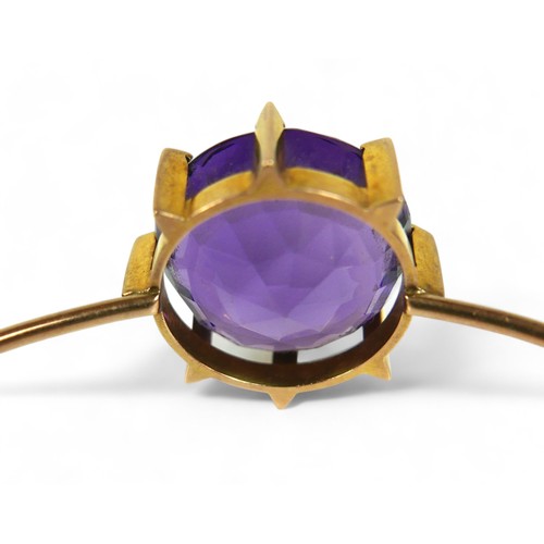 145 - An amethyst and 15ct gold bangle, the bracelet with large single large round-cut purple amethyst, 20... 