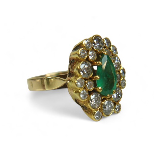 146 - An abstract emerald and diamond ring on 14ct gold band, stamped 585, the deep green pear / teardrop-... 