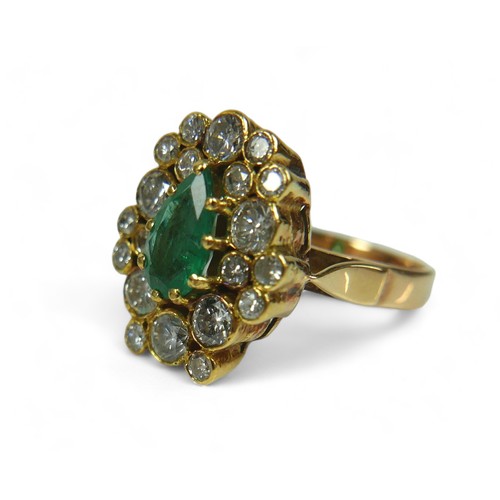 146 - An abstract emerald and diamond ring on 14ct gold band, stamped 585, the deep green pear / teardrop-... 