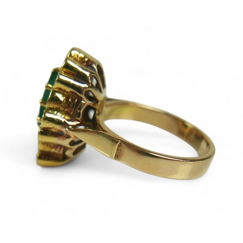 146 - An abstract emerald and diamond ring on 14ct gold band, stamped 585, the deep green pear / teardrop-... 