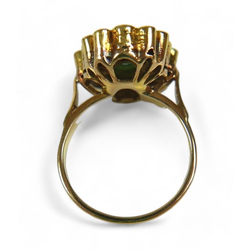 146 - An abstract emerald and diamond ring on 14ct gold band, stamped 585, the deep green pear / teardrop-... 