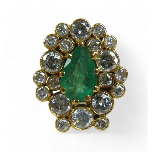 146 - An abstract emerald and diamond ring on 14ct gold band, stamped 585, the deep green pear / teardrop-... 