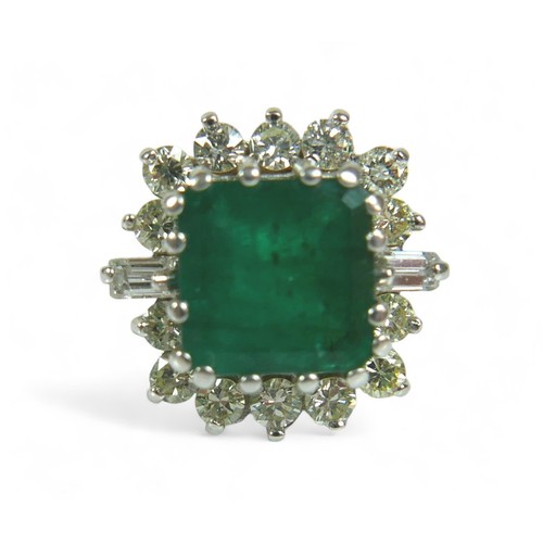 147 - A square-cut emerald and diamond ring, the central dark green emerald approx 8mm by 8mm, surrounded ... 