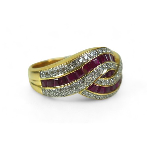 144 - A ruby and diamond ring, on thick 18ct yellow gold band, the unusual crossover wave design with 26 r... 