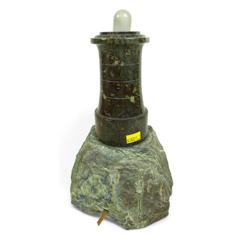 391 - A serpentine table lamp, in the form of a lighthouse, with replacement glass, 15 by 15 by 33cm high.