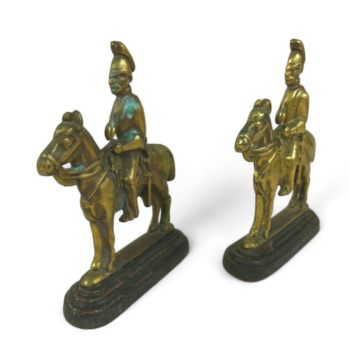 364 - A pair of brass and iron doorstops, in the form of cavalry soldiers, 18 by 5 by 26cm high. (2)