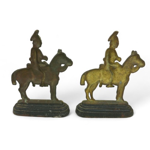 364 - A pair of brass and iron doorstops, in the form of cavalry soldiers, 18 by 5 by 26cm high. (2)