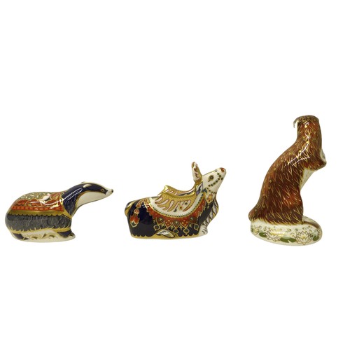 225 - A group of three boxed Royal Crown Derby paperweights, comprising Reindeer, Playful Otter for (Conna... 