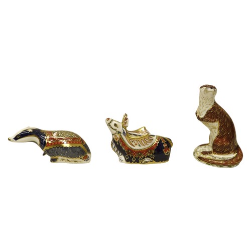 225 - A group of three boxed Royal Crown Derby paperweights, comprising Reindeer, Playful Otter for (Conna... 