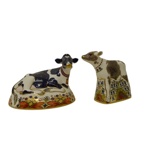 207 - Two boxed Royal Crown Derby paperweights, 'Buttercup' Friesian Cow, a/f, 'Bluebell' Calf, both with ... 