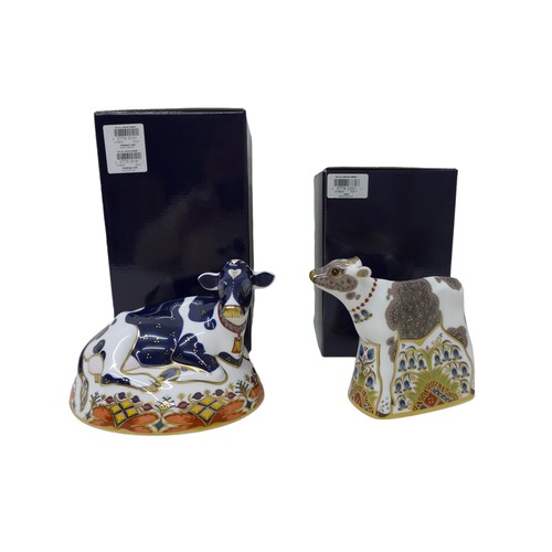 207 - Two boxed Royal Crown Derby paperweights, 'Buttercup' Friesian Cow, a/f, 'Bluebell' Calf, both with ... 