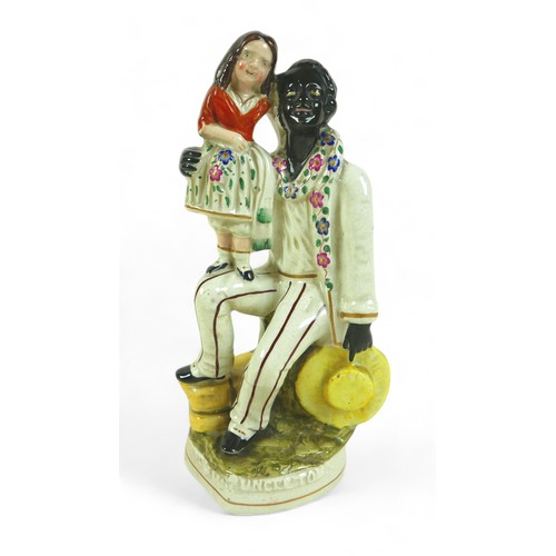 213 - A Victorian Staffordshire figure group, 'Uncle Tom', 26.5cm high, together with a Royal Doulton twin... 