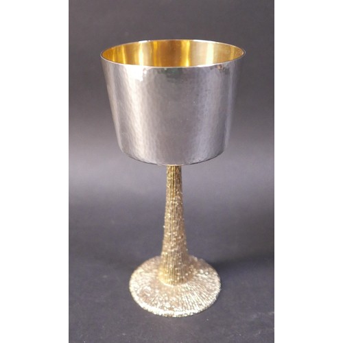 1 - A set of six Stuart Devlin silver goblets, the bowls decorated with hammered finish, gilt interior, ... 