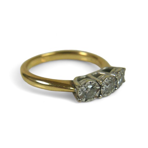 94 - A 9ct gold and three stone diamond ring, each stone brilliant cut in illusion setting, size M, 3.6g.