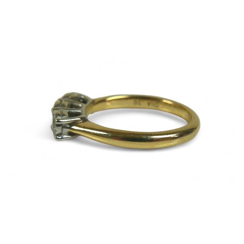 94 - A 9ct gold and three stone diamond ring, each stone brilliant cut in illusion setting, size M, 3.6g.