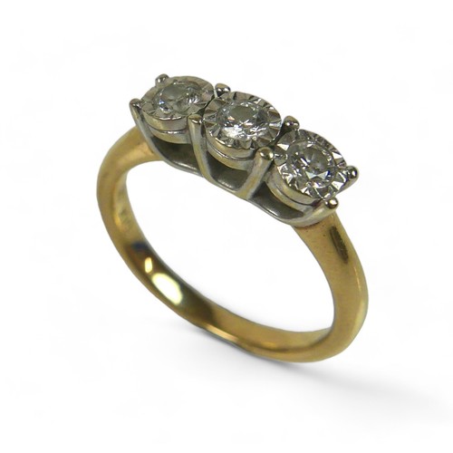 94 - A 9ct gold and three stone diamond ring, each stone brilliant cut in illusion setting, size M, 3.6g.