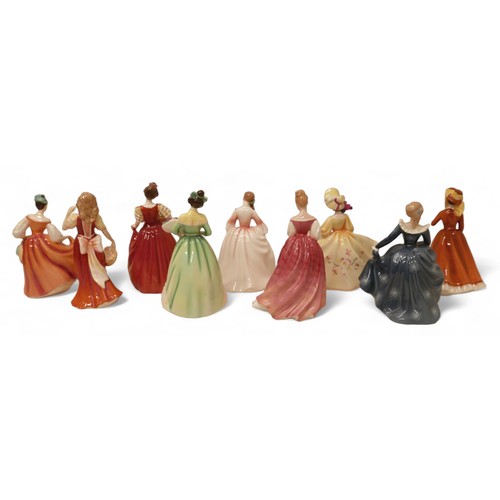 221 - A group of nine Royal Doulton figurines, comprising Fair Lady, HN2835, Julia HN2705, Alexandra, HN32... 