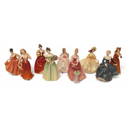 221 - A group of nine Royal Doulton figurines, comprising Fair Lady, HN2835, Julia HN2705, Alexandra, HN32... 