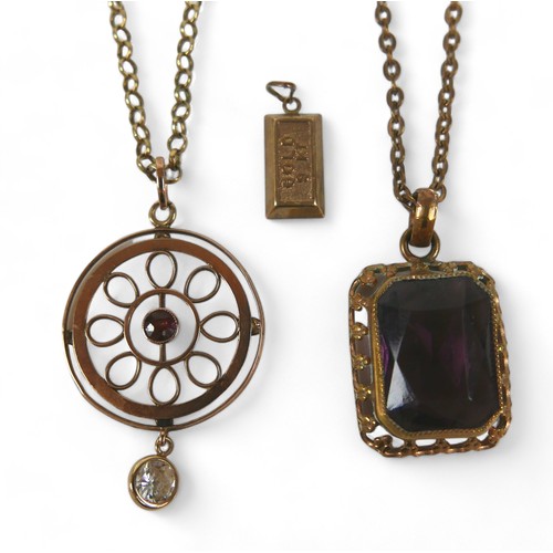 49 - A 9ct gold and ruby circular pendant, on thin gold chain, plus a small 9kt gold ingot pendant, 0.7g,... 