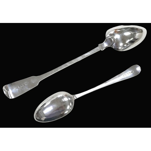 29 - Two George III silver spoons, comprising a large fiddle back pattern basting spoon, monogram to the ... 