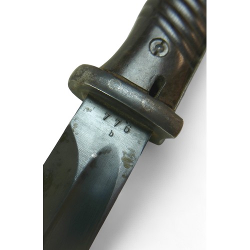 321 - A German WWII bayonet, with steel scabbard, the blade stamped 'Jos Corts Sn', '776 b', and with date... 