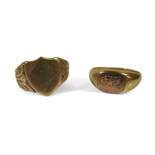 102 - Two 9ct gold signet rings, one with a dragon insignia, 4.8g, and another shield form signet ring, a/... 