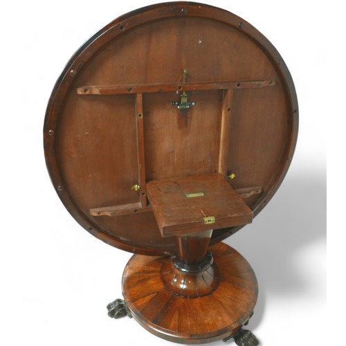 542 - A William IV rosewood breakfast table, circular tilt top on an turned column with lappet carving, ra... 