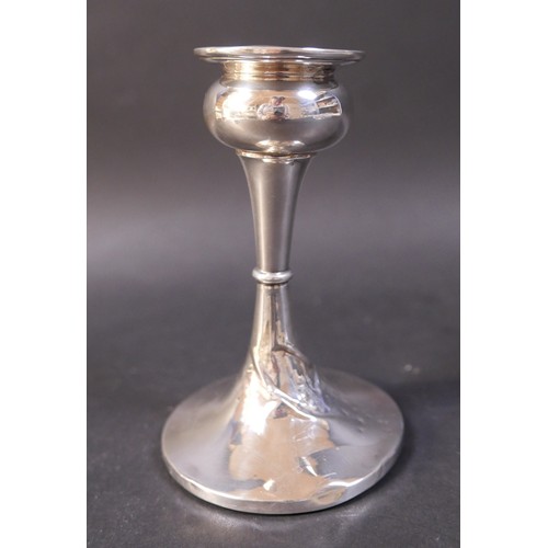 30 - A collection of silver ware, comprising a three piece cruet, a weighted candlestick 9 by 14cm high a... 