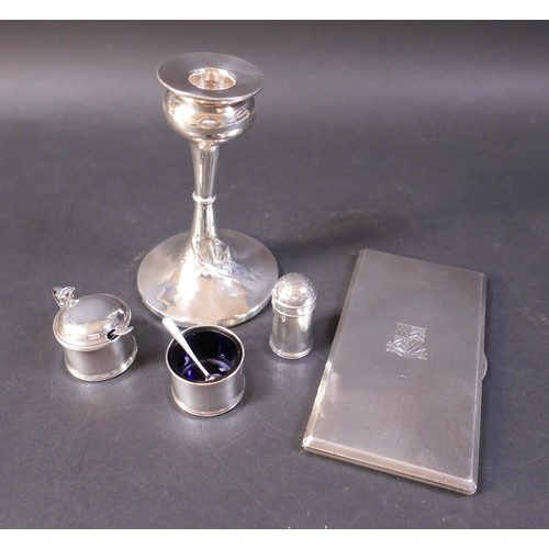 30 - A collection of silver ware, comprising a three piece cruet, a weighted candlestick 9 by 14cm high a... 