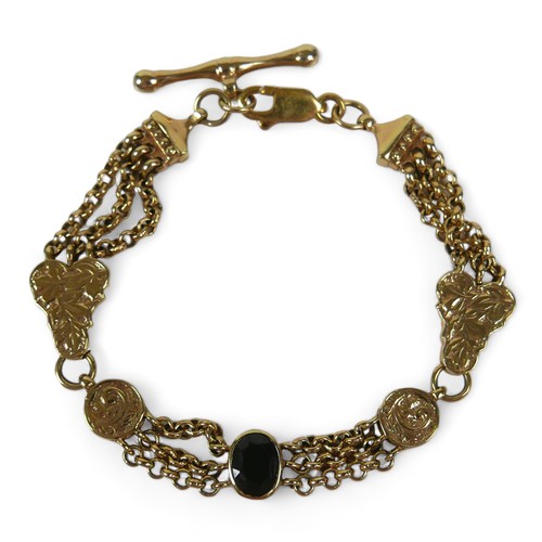 125 - A 9ct yellow gold fancy watch chain link bracelet set with a single garnet, 20.5 by 3cm, 20.2gs.